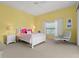 Cozy bedroom featuring a tray ceiling and neutral color scheme at 13215 Palmers Creek Ter, Lakewood Ranch, FL 34202