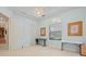 A light blue bedroom featuring decoratively framed art and arched windows at 13215 Palmers Creek Ter, Lakewood Ranch, FL 34202