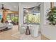 Cozy breakfast nook with a glass table, two chairs, a view of the pool, and backyard at 13215 Palmers Creek Ter, Lakewood Ranch, FL 34202
