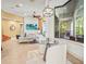 Bright breakfast nook featuring a glass table, stylish light fixture, and views of the outdoor patio at 13215 Palmers Creek Ter, Lakewood Ranch, FL 34202
