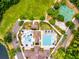 Aerial shot showcasing community amenities with swimming pools, basketball court, and beautifully landscaped surroundings at 13215 Palmers Creek Ter, Lakewood Ranch, FL 34202