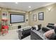 Dedicated home theater with reclining seats, a large screen, and custom lighting for an immersive entertainment experience at 13215 Palmers Creek Ter, Lakewood Ranch, FL 34202