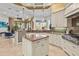 Bright open kitchen with stainless appliances, granite counters, and a breakfast area with outdoor views at 13215 Palmers Creek Ter, Lakewood Ranch, FL 34202