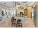 Open kitchen with a breakfast bar, pendant lighting, custom cabinetry, and access to the living room at 13215 Palmers Creek Ter, Lakewood Ranch, FL 34202