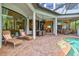 Expansive outdoor lanai overlooking the pool and the lush landscaping at 13215 Palmers Creek Ter, Lakewood Ranch, FL 34202