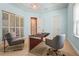 Well-lit office featuring built-in storage and modern furniture at 13215 Palmers Creek Ter, Lakewood Ranch, FL 34202