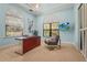 Office space with modern furniture, large windows, and a TV at 13215 Palmers Creek Ter, Lakewood Ranch, FL 34202