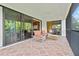 Spacious outdoor patio with comfortable seating and sliding glass doors at 13215 Palmers Creek Ter, Lakewood Ranch, FL 34202