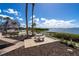 Stone patio with seating offers waterfront views and landscaping at 1602 Stickney Point Rd # 305, Sarasota, FL 34231