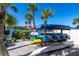 Kayak storage area with kayaks, trailer, and waterfront views at 1602 Stickney Point Rd # 305, Sarasota, FL 34231