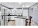 Kitchen featuring stainless steel appliances, granite countertops and counter seating at 1602 Stickney Point Rd # 305, Sarasota, FL 34231