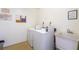 Well-lit community laundry room featuring sink and laundry machines at 1602 Stickney Point Rd # 305, Sarasota, FL 34231