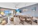 A cozy living room featuring water view, dining area and comfortable seating at 1602 Stickney Point Rd # 305, Sarasota, FL 34231