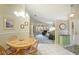 Dining area with a round table and chairs, overlooking the living room at 4098 Fairway Pl, North Port, FL 34287