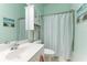 Small bathroom with shower and white vanity at 4098 Fairway Pl, North Port, FL 34287