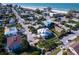 Aerial view of a waterfront home in a beach neighborhood at 3702 5Th Ave, Holmes Beach, FL 34217