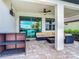 Relaxing covered patio with seating area and view of pool at 177 Vinadio Blvd, Nokomis, FL 34275