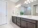Double vanity bathroom with a large mirror and plenty of counter space at 177 Vinadio Blvd, Nokomis, FL 34275