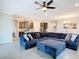 Open living room with a sectional sofa and views into the kitchen at 177 Vinadio Blvd, Nokomis, FL 34275