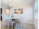 Bright dining room with a light wood table and chairs at 177 Vinadio Blvd, Nokomis, FL 34275