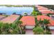 An aerial view of a home with a red tile roof and a two-car garage at 177 Vinadio Blvd, Nokomis, FL 34275