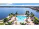 Stunning aerial view of resort-style pool and lake at 177 Vinadio Blvd, Nokomis, FL 34275