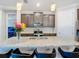 Island kitchen with granite countertops and stainless steel appliances at 177 Vinadio Blvd, Nokomis, FL 34275
