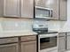 Stainless steel appliances and granite countertops in this kitchen at 177 Vinadio Blvd, Nokomis, FL 34275
