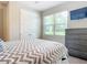 Guest bedroom with a double bed and large window at 177 Vinadio Blvd, Nokomis, FL 34275