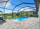 Inviting screened pool and spa with patio seating at 177 Vinadio Blvd, Nokomis, FL 34275