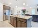 Modern kitchen with stainless steel appliances and granite countertops at 177 Vinadio Blvd, Nokomis, FL 34275