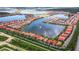 Aerial view of a luxury community with lakefront homes at 177 Vinadio Blvd, Nokomis, FL 34275