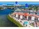 Aerial view of condo with pool and bay views at 1602 Stickney Point Rd # 305, Sarasota, FL 34231
