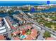 Aerial view highlighting condo and pool at 1602 Stickney Point Rd # 305, Sarasota, FL 34231