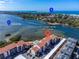 Aerial view showcasing condo and bay views at 1602 Stickney Point Rd # 305, Sarasota, FL 34231