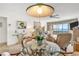 Elegant dining area with glass-top table and water views at 1602 Stickney Point Rd # 305, Sarasota, FL 34231