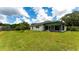 Large backyard with green grass and home view at 4556 31St E Ct, Bradenton, FL 34203