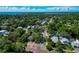 Aerial view of neighborhood near the water, featuring lush trees and various house styles at 150 21St S Ave, St Petersburg, FL 33705