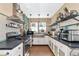 Modern kitchen with stainless steel appliances and white shaker cabinets at 150 21St S Ave, St Petersburg, FL 33705