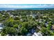 Aerial perspective of a residential area with houses surrounded by green trees and ocean view at 150 21St S Ave, St Petersburg, FL 33705