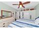 Bedroom with white dresser and ceiling fan at 150 21St S Ave, St Petersburg, FL 33705