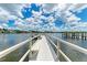 Spacious waterfront dock with seating area at 6157 Midnight Pass Rd # C12, Sarasota, FL 34242