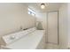 Laundry room with washer, dryer, and ironing board at 6157 Midnight Pass Rd # C12, Sarasota, FL 34242
