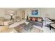Cozy living room featuring comfortable seating, a coffee table, and tasteful decor at 6157 Midnight Pass Rd # C12, Sarasota, FL 34242