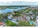 Aerial view of waterfront community with pool and lush landscaping at 6157 Midnight Pass Rd # C12, Sarasota, FL 34242
