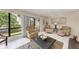 Bright living room with patio access and comfortable seating at 6157 Midnight Pass Rd # C12, Sarasota, FL 34242