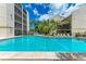 Inviting community pool with surrounding patio furniture at 6157 Midnight Pass Rd # C12, Sarasota, FL 34242