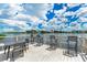 Waterfront dock with table and chairs offering scenic views at 6157 Midnight Pass Rd # C12, Sarasota, FL 34242