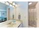 Small bathroom with single vanity and shower at 6157 Midnight Pass Rd # C12, Sarasota, FL 34242