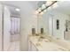 Bathroom with a double vanity and shower/tub combo at 6157 Midnight Pass Rd # C12, Sarasota, FL 34242